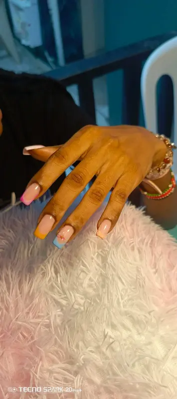 Pastel blue, yellow and pink square French tips, supplied by NBD
